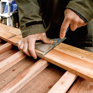 12. Position the top rail adjacent to the bottom rail and transfer the baluster locations, again making a dimple with your awl.