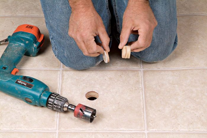 Drilling a 1-in. pilot hole will tell you how thick the subfloor is.