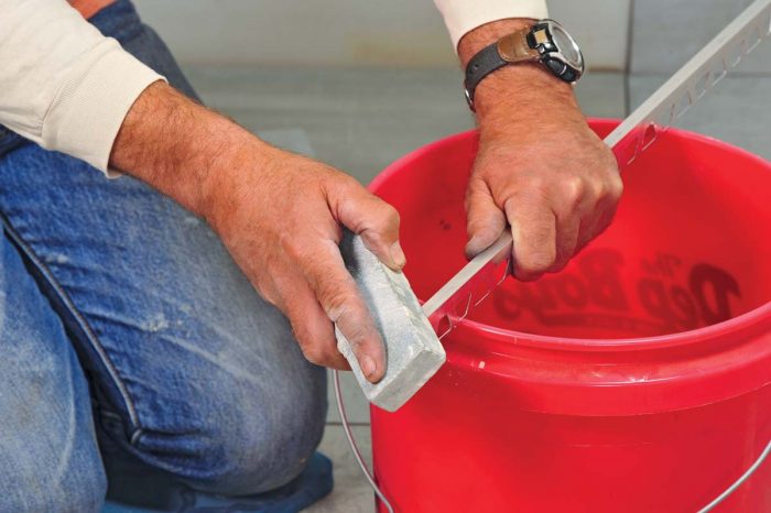 Use a rubbing stone to remove and smooth any burrs.